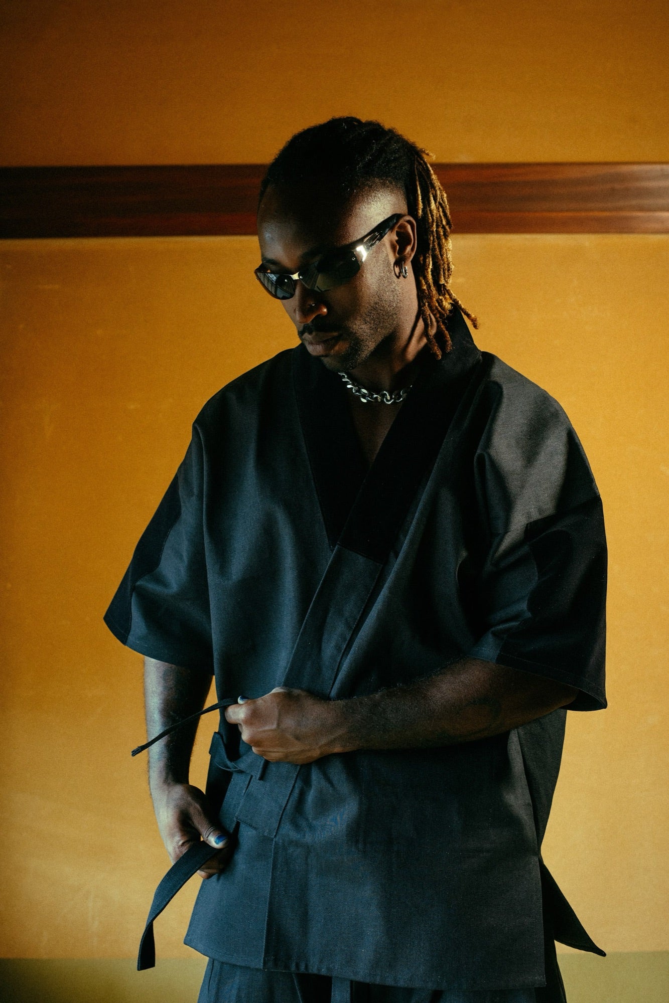 Tying the obi on a Stillness samue